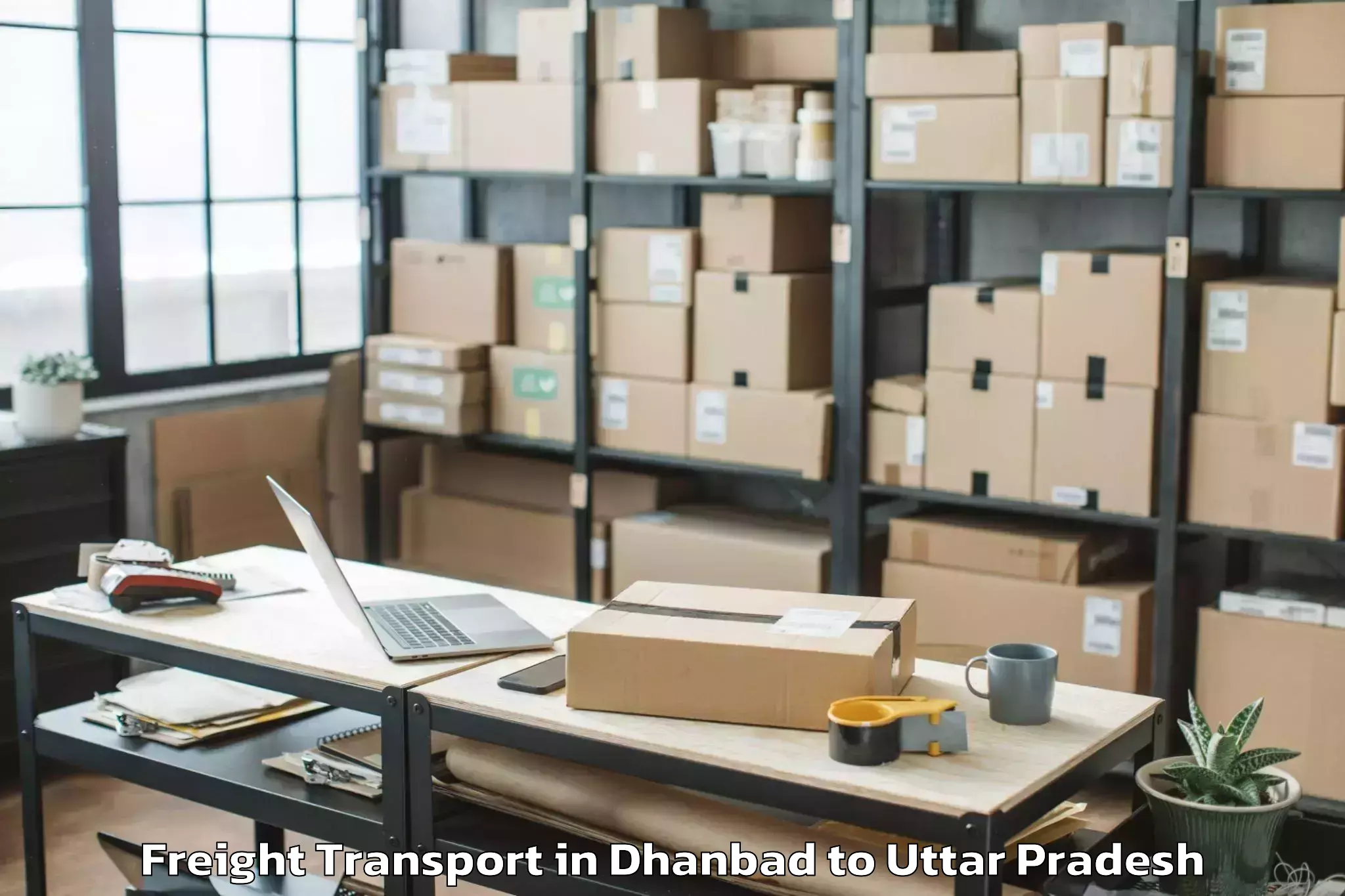 Efficient Dhanbad to Js University Shikohabad Freight Transport